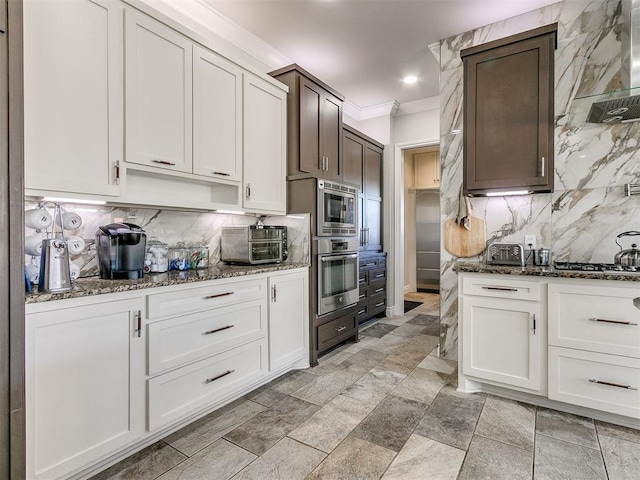 6363 NW 220th St, Edmond, OK 73025 - kitchen featuring backsplash, ornamental molding, dark stone countertops, and stainless steel appliances