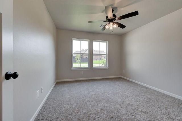 3404 Slate River Dr, Yukon, OK 73099 - spare room with carpet flooring, ceiling fan, and baseboards