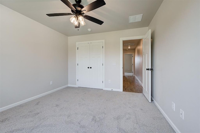 3404 Slate River Dr, Yukon, OK 73099 - unfurnished bedroom with carpet, baseboards, a closet, ceiling fan, and attic access