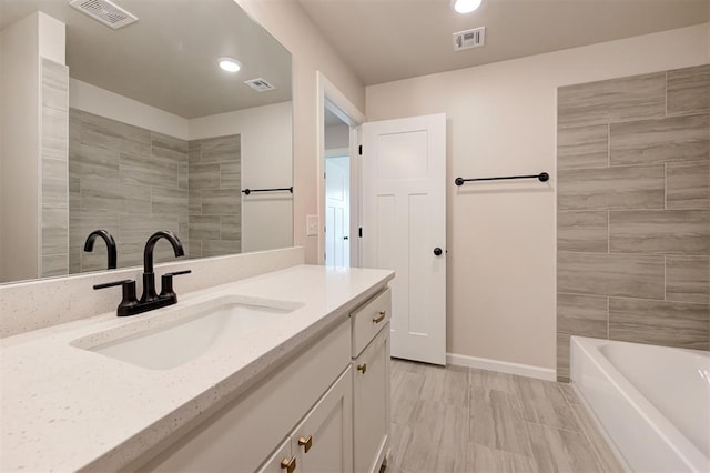 3404 Slate River Dr, Yukon, OK 73099 - bathroom with vanity, recessed lighting, baseboards, and  shower combination