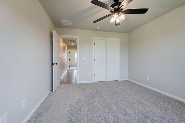 3404 Slate River Dr, Yukon, OK 73099 - unfurnished bedroom featuring light carpet, baseboards, and a closet