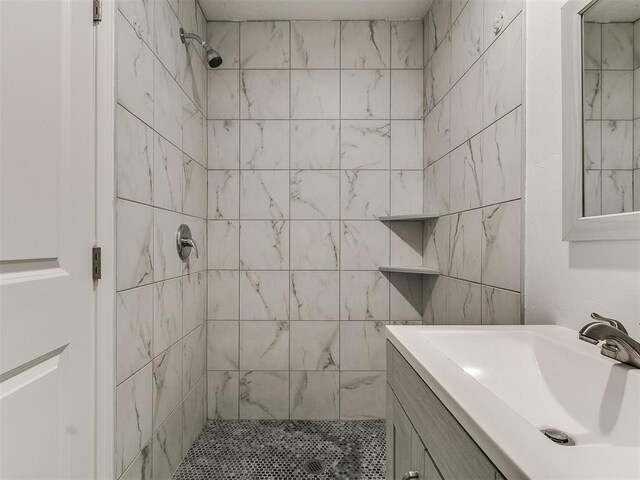 bathroom with vanity and a stall shower