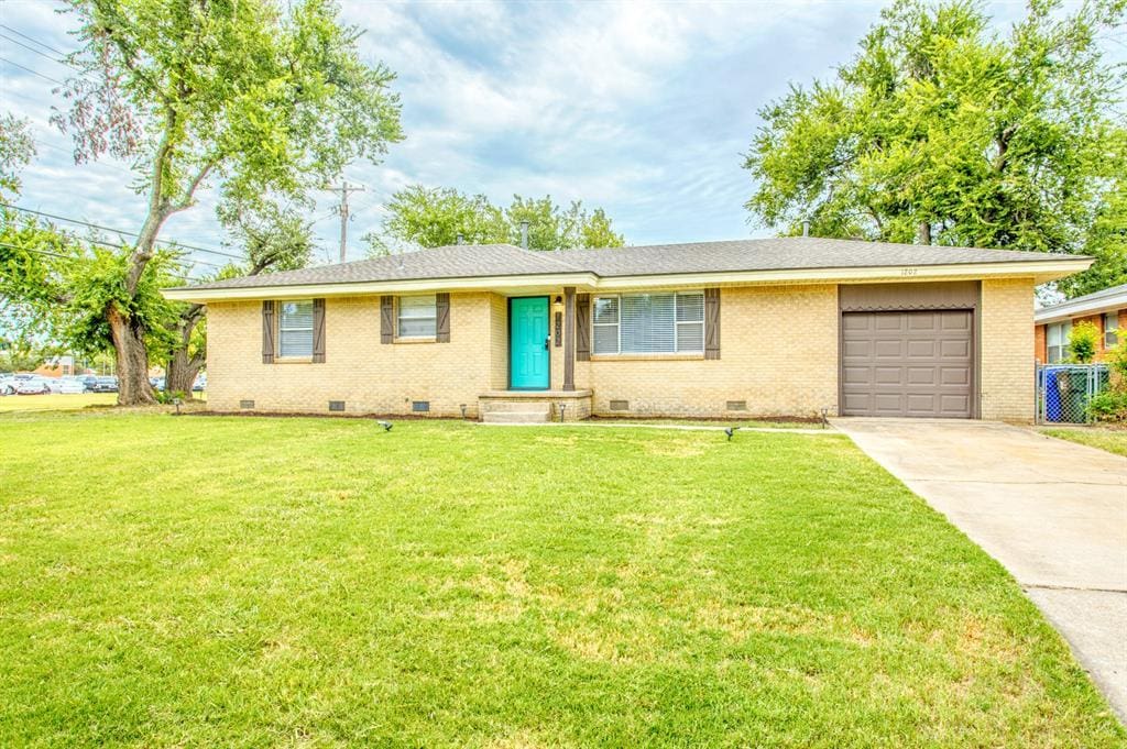 1202 Barbour St, Norman, OK 73069 - ranch-style home with an attached garage, crawl space, driveway, brick siding, and a front yard