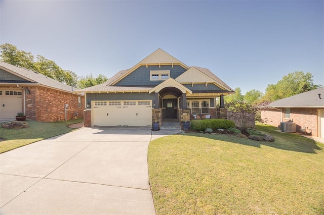 4940 Sonny Blues Pl, Edmond, OK 73034 - craftsman-style house featuring a front lawn, central AC unit, a porch, concrete driveway, and an attached garage