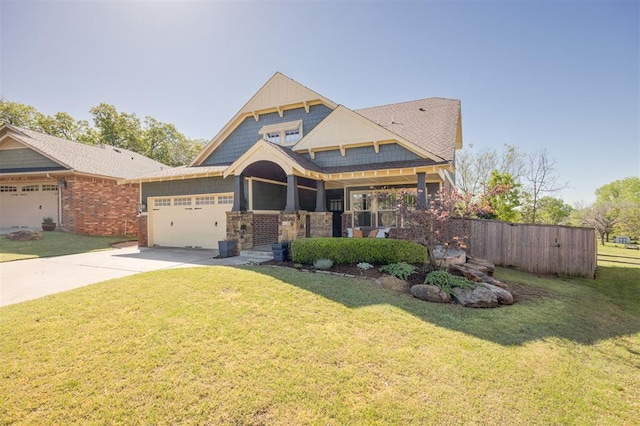 4940 Sonny Blues Pl, Edmond, OK 73034 - craftsman-style home featuring an attached garage, driveway, fence, and a front yard
