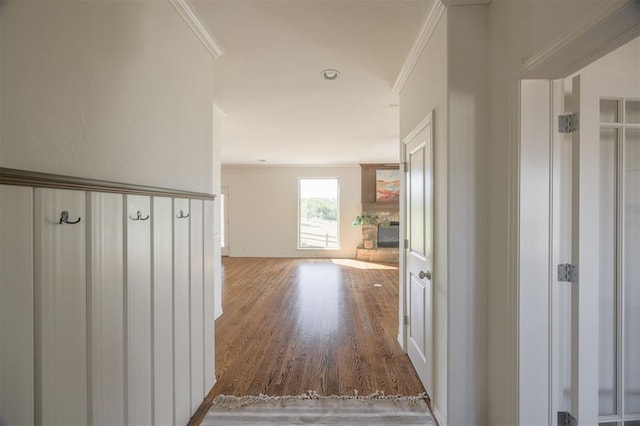 4940 Sonny Blues Pl, Edmond, OK 73034 - corridor featuring wood finished floors and ornamental molding