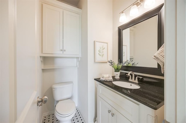 4940 Sonny Blues Pl, Edmond, OK 73034 - bathroom featuring toilet, vanity, and baseboards