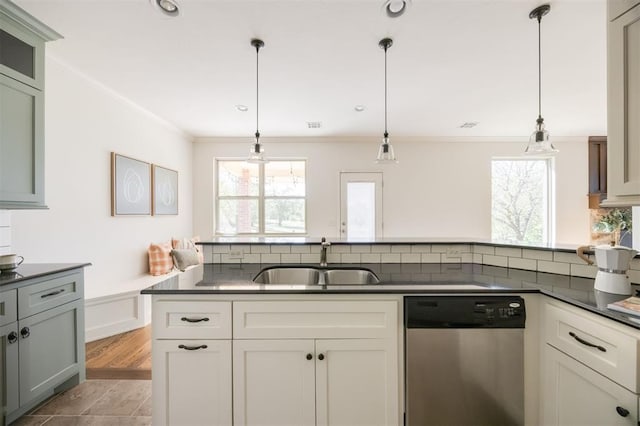 4940 Sonny Blues Pl, Edmond, OK 73034 - kitchen with dark countertops, stainless steel dishwasher, and a sink