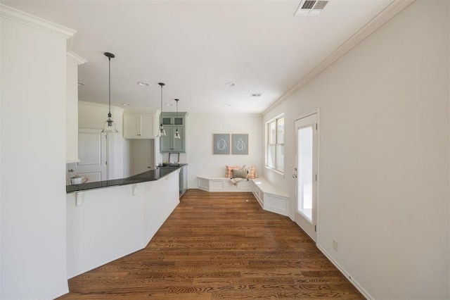 4940 Sonny Blues Pl, Edmond, OK 73034 - interior space featuring visible vents, recessed lighting, dark wood-type flooring, and ornamental molding
