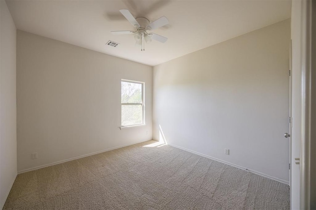 4940 Sonny Blues Pl, Edmond, OK 73034 - carpeted empty room with baseboards, a ceiling fan, and visible vents