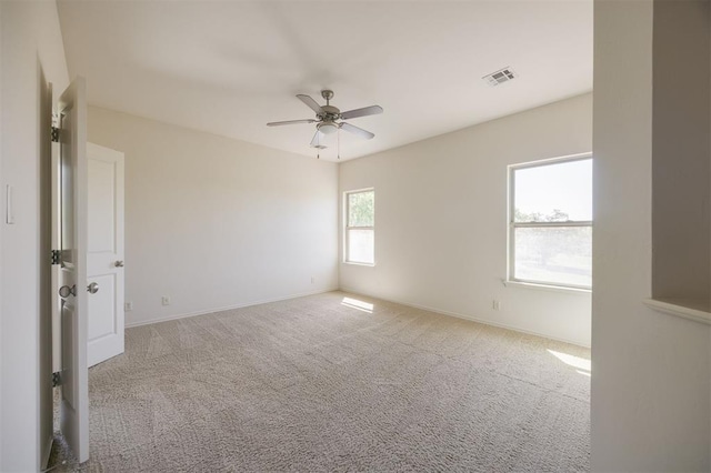 4940 Sonny Blues Pl, Edmond, OK 73034 - unfurnished room featuring baseboards, a ceiling fan, visible vents, and carpet
