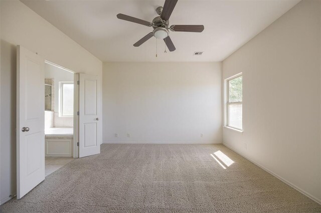 4940 Sonny Blues Pl, Edmond, OK 73034 - unfurnished room featuring baseboards, visible vents, a ceiling fan, and light colored carpet