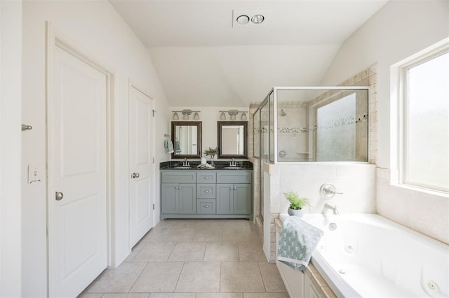 4940 Sonny Blues Pl, Edmond, OK 73034 - full bath with lofted ceiling, tile patterned floors, a sink, and a shower stall