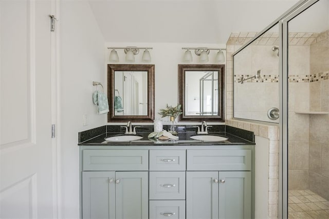 4940 Sonny Blues Pl, Edmond, OK 73034 - full bathroom with double vanity, a shower stall, and a sink