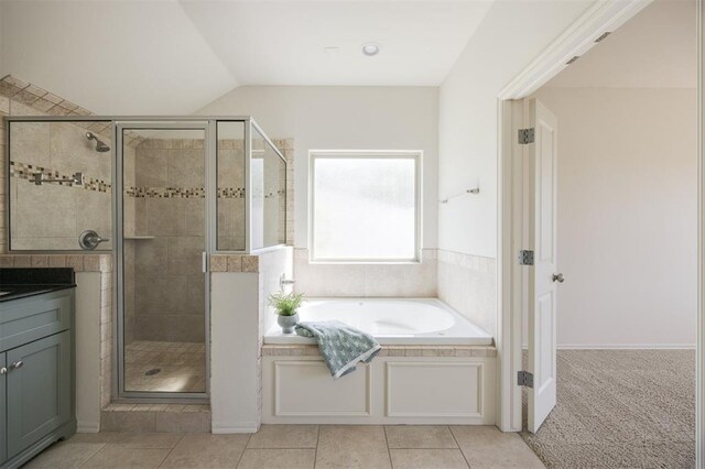 4940 Sonny Blues Pl, Edmond, OK 73034 - bathroom with a shower stall, tile patterned flooring, vaulted ceiling, vanity, and a bath