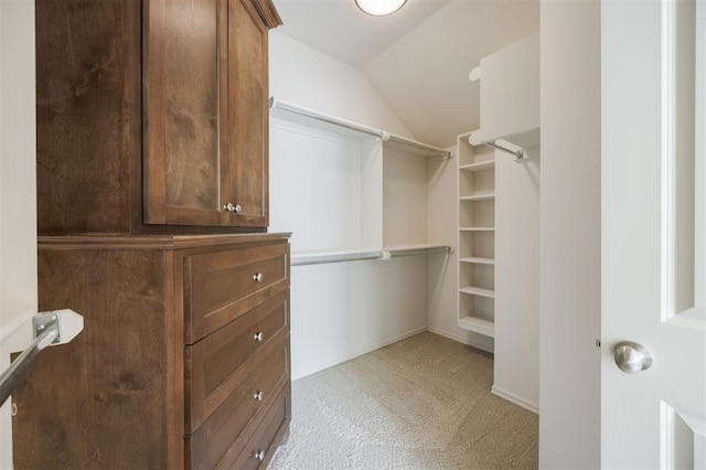 4940 Sonny Blues Pl, Edmond, OK 73034 - walk in closet featuring lofted ceiling and light colored carpet