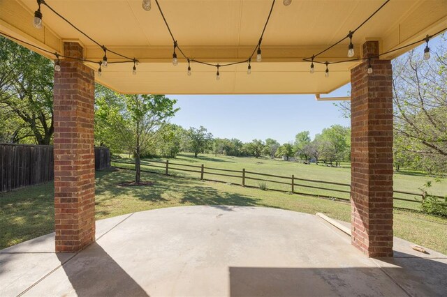 4940 Sonny Blues Pl, Edmond, OK 73034 - view of patio with a rural view and fence