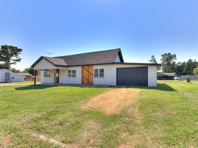 603 N Madison Ave, Blanchard, OK 73010 - ranch-style house with an attached garage, brick siding, a shingled roof, and a front yard
