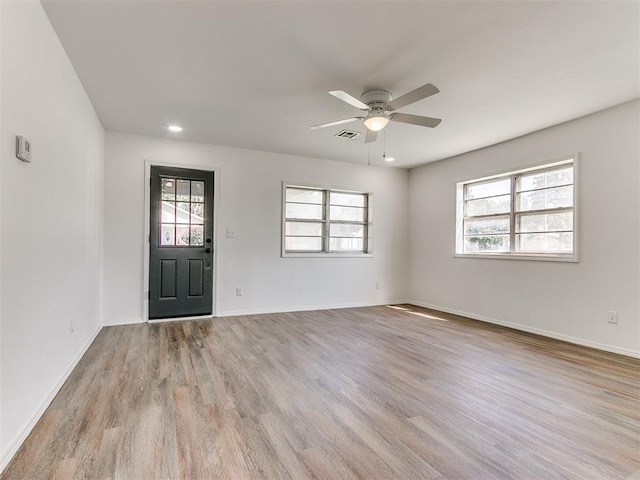 603 N Madison Ave, Blanchard, OK 73010 - foyer entrance with a ceiling fan, wood finished floors, visible vents, and plenty of natural light