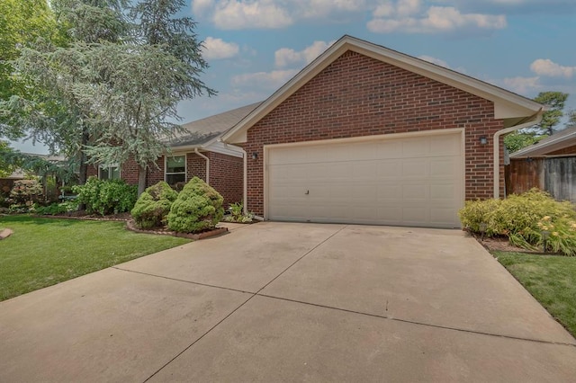 1117 Blue Ridge Dr, Edmond, OK 73003 - ranch-style home featuring brick siding, a front lawn, driveway, and a garage
