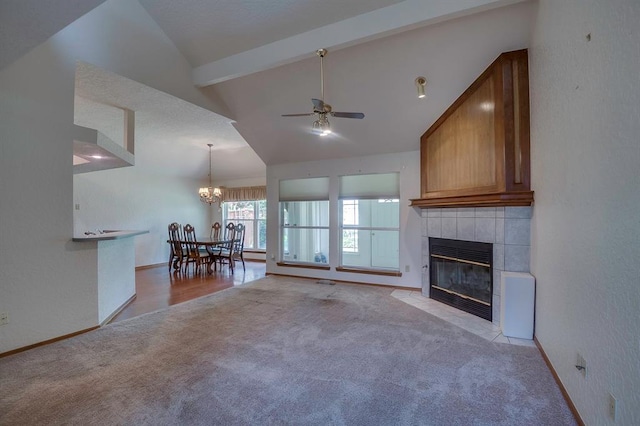 1117 Blue Ridge Dr, Edmond, OK 73003 - living area featuring light colored carpet, a tile fireplace, ceiling fan, a chandelier, and baseboards