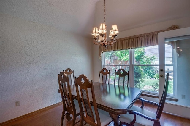 1117 Blue Ridge Dr, Edmond, OK 73003 - dining room featuring a textured wall, a chandelier, baseboards, and wood finished floors