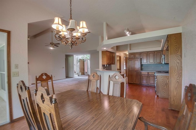 1117 Blue Ridge Dr, Edmond, OK 73003 - dining space with a chandelier, lofted ceiling, ceiling fan, and wood finished floors
