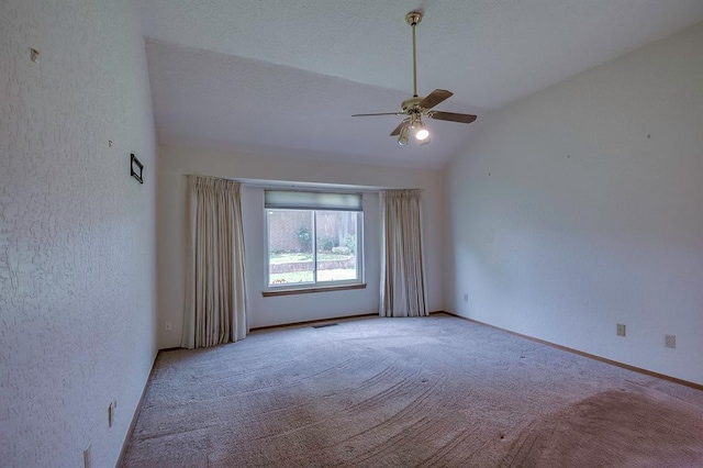 1117 Blue Ridge Dr, Edmond, OK 73003 - carpeted empty room featuring lofted ceiling, a ceiling fan, a textured wall, and baseboards