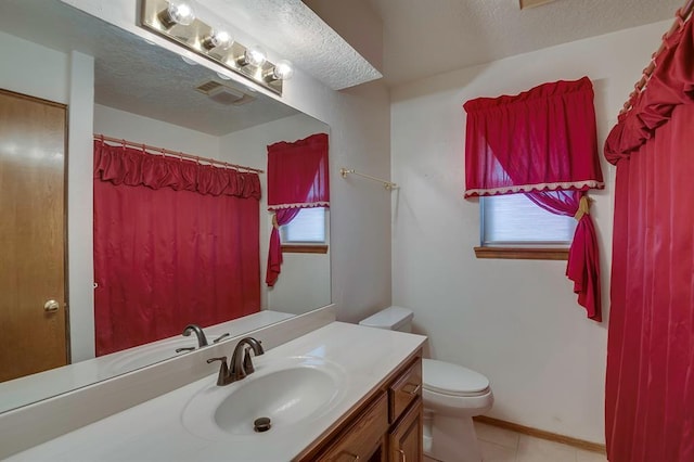 1117 Blue Ridge Dr, Edmond, OK 73003 - full bathroom with vanity, toilet, tile patterned flooring, a textured ceiling, and a shower with shower curtain