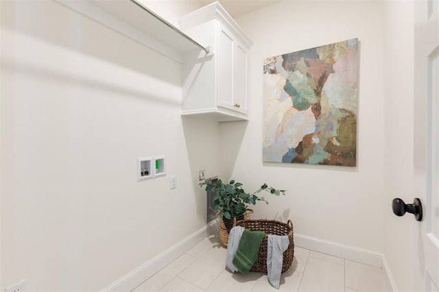 laundry area featuring baseboards, cabinet space, hookup for a washing machine, and light tile patterned floors