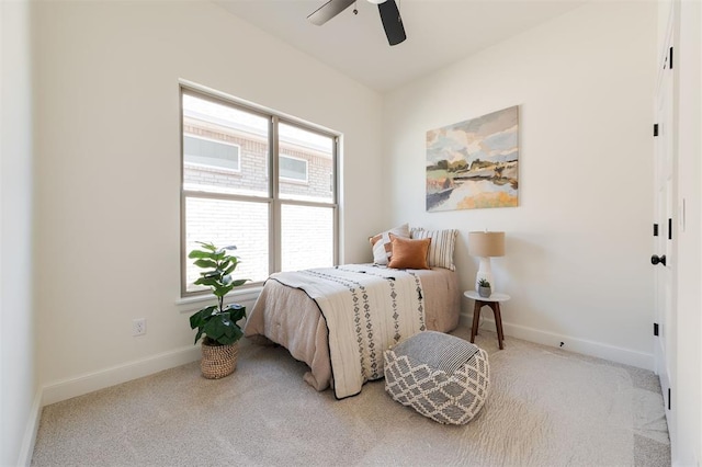 carpeted bedroom featuring ceiling fan and baseboards