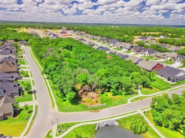 birds eye view of property with a residential view