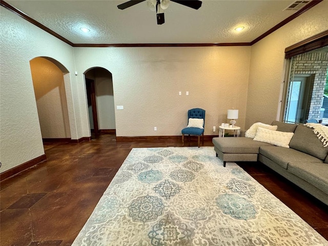 living room with a textured ceiling, a textured wall, and arched walkways