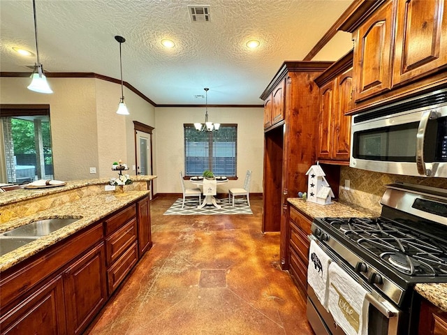 kitchen with a textured ceiling, decorative backsplash, a chandelier, stainless steel appliances, and light stone countertops
