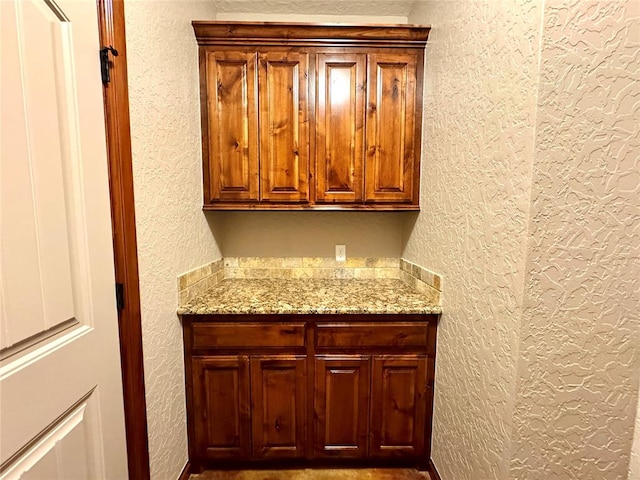 bar featuring a textured wall