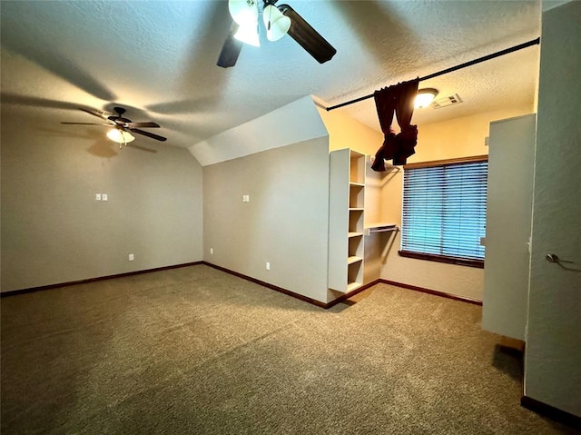bonus room featuring a ceiling fan, visible vents, carpet, and baseboards
