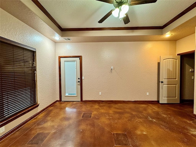 unfurnished room featuring finished concrete floors, crown molding, ceiling fan, a textured wall, and visible vents
