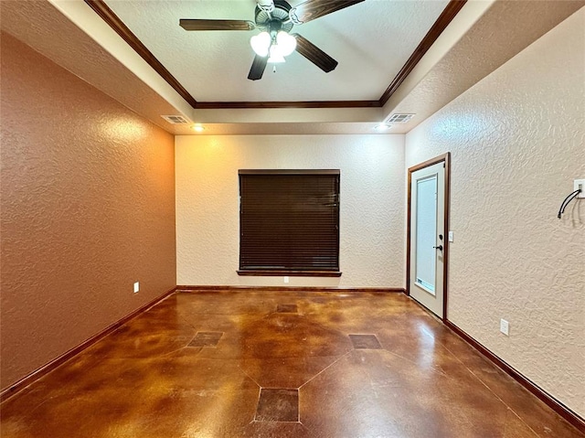 unfurnished room with visible vents, ornamental molding, a textured wall, and a tray ceiling