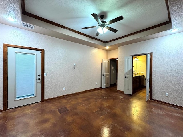 unfurnished bedroom featuring visible vents, ornamental molding, a textured ceiling, and a textured wall