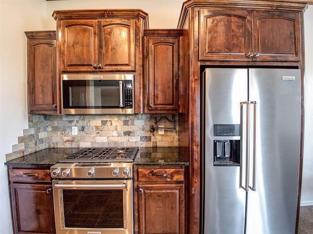 1416 Glenolde Pl, Edmond, OK 73003 - kitchen featuring dark stone counters, appliances with stainless steel finishes, and backsplash