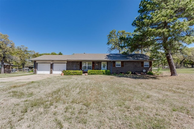 ranch-style house with concrete driveway, a front lawn, brick siding, and a garage