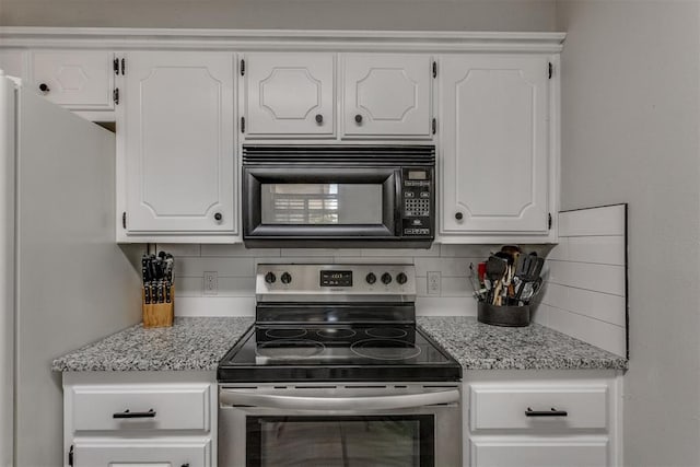 kitchen featuring stainless steel electric stove, tasteful backsplash, black microwave, and white cabinets