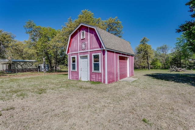 view of barn featuring a lawn
