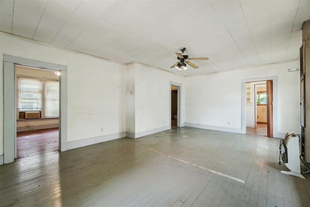 912 Classen Blvd, Norman, OK 73071 - spare room featuring plenty of natural light, hardwood / wood-style floors, ceiling fan, and baseboards