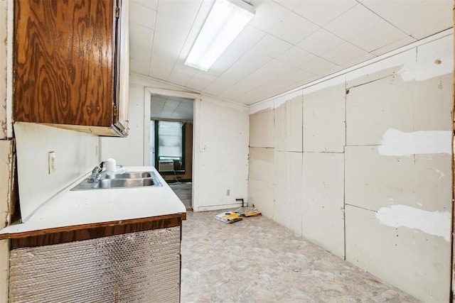 912 Classen Blvd, Norman, OK 73071 - kitchen featuring a sink, light countertops, and lofted ceiling