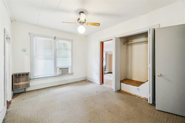 912 Classen Blvd, Norman, OK 73071 - unfurnished bedroom with carpet flooring, a closet, cooling unit, ceiling fan, and baseboards