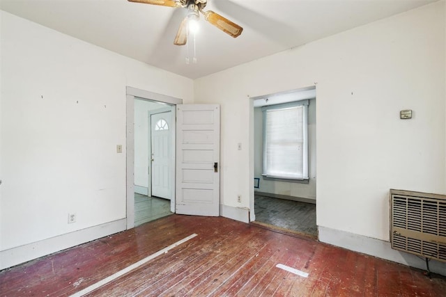 912 Classen Blvd, Norman, OK 73071 - empty room featuring wood-type flooring, a ceiling fan, and heating unit