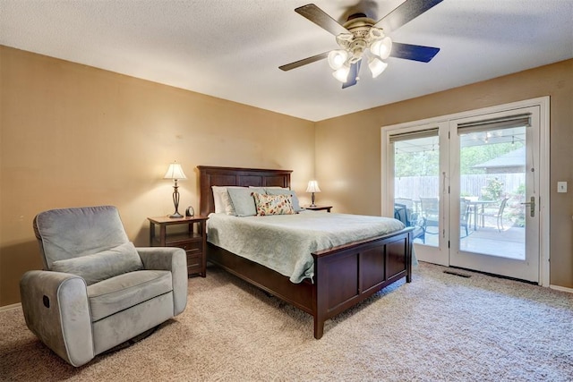 bedroom featuring access to outside, light carpet, baseboards, visible vents, and a ceiling fan