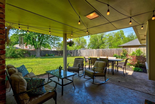 view of patio / terrace with outdoor lounge area, outdoor dining space, and a fenced backyard