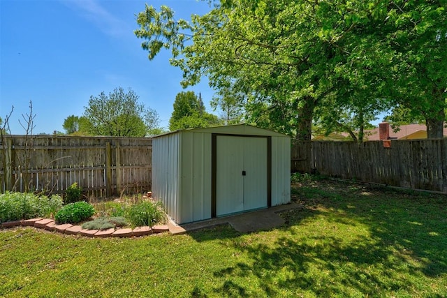 view of shed featuring a fenced backyard